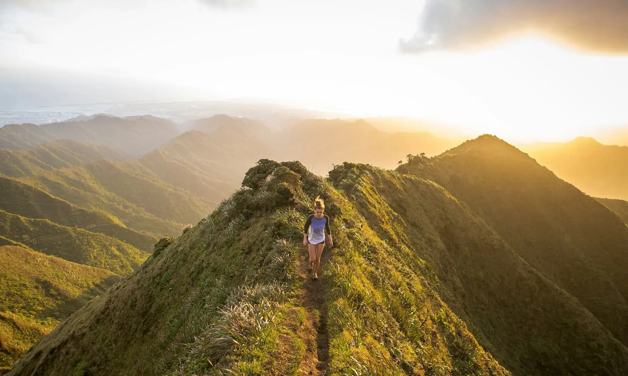 Hiker on a ridge at golden hour — a path forward with opioid use disorder treatment in Modesto, CA