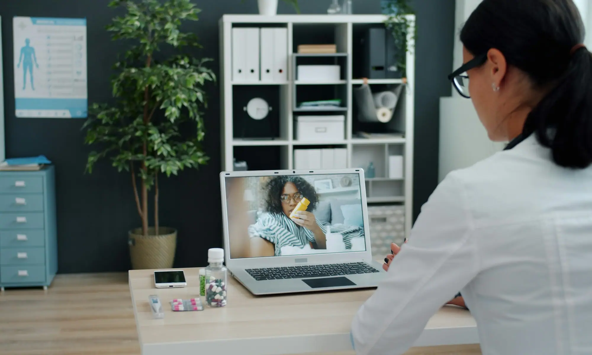Physician on a video call with a patient — telemedicine addiction treatment across California