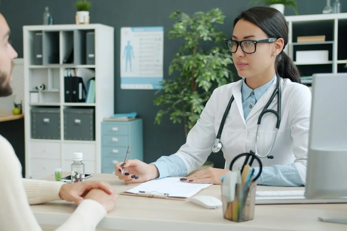 Physician completing a medical evaluation with a patient for alcohol use disorder